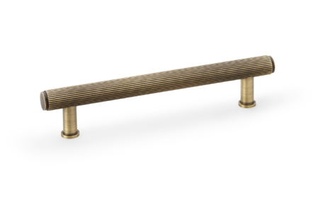 View Alexander & Wilks Crispin Reeded T-bar Cupboard Pull Handle - Antique Brass - 128mm offered by HiF Kitchens