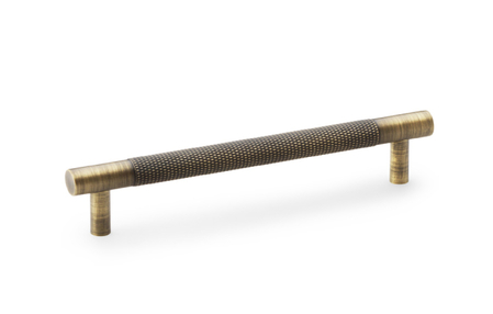 View Alexander & Wilks Brunel Knurled T-Bar Cupboard Handle - Antique Brass - Centres 128mm offered by HiF Kitchens