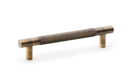View Alexander & Wilks Brunel Knurled T-Bar Cupboard Handle - Antique Brass - Centres 96mm offered by HiF Kitchens