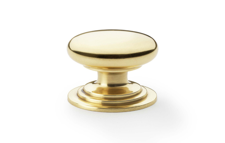 View Alexander & Wilks Waltz Round Cupboard Knob on Stepped Rose - Polished Brass - 38mm offered by HiF Kitchens