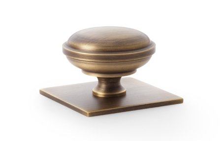 View Alexander & Wilks Quantock Cupboard Knob on Square Backplate - Antique Brass - 38mm offered by HiF Kitchens