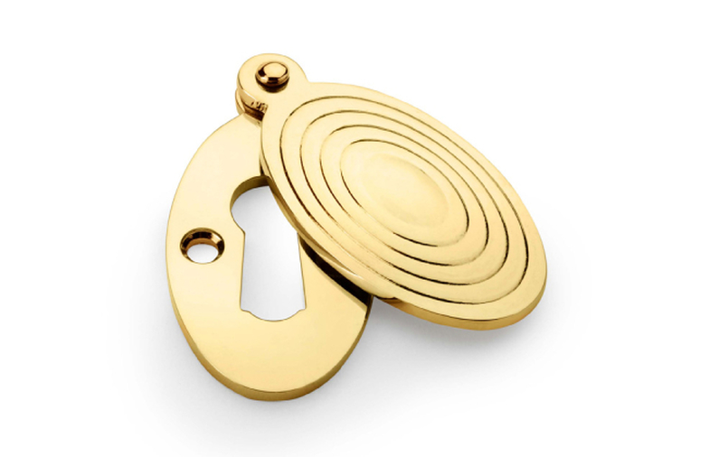 Alexander & Wilks Standard Key Profile Ellipse Escutcheon with Christoph Design Cover - Unlacquered Brass Image 1