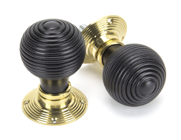 View Ebony & Polished Brass Beehive Mortice/Rim Knob Set offered by HiF Kitchens